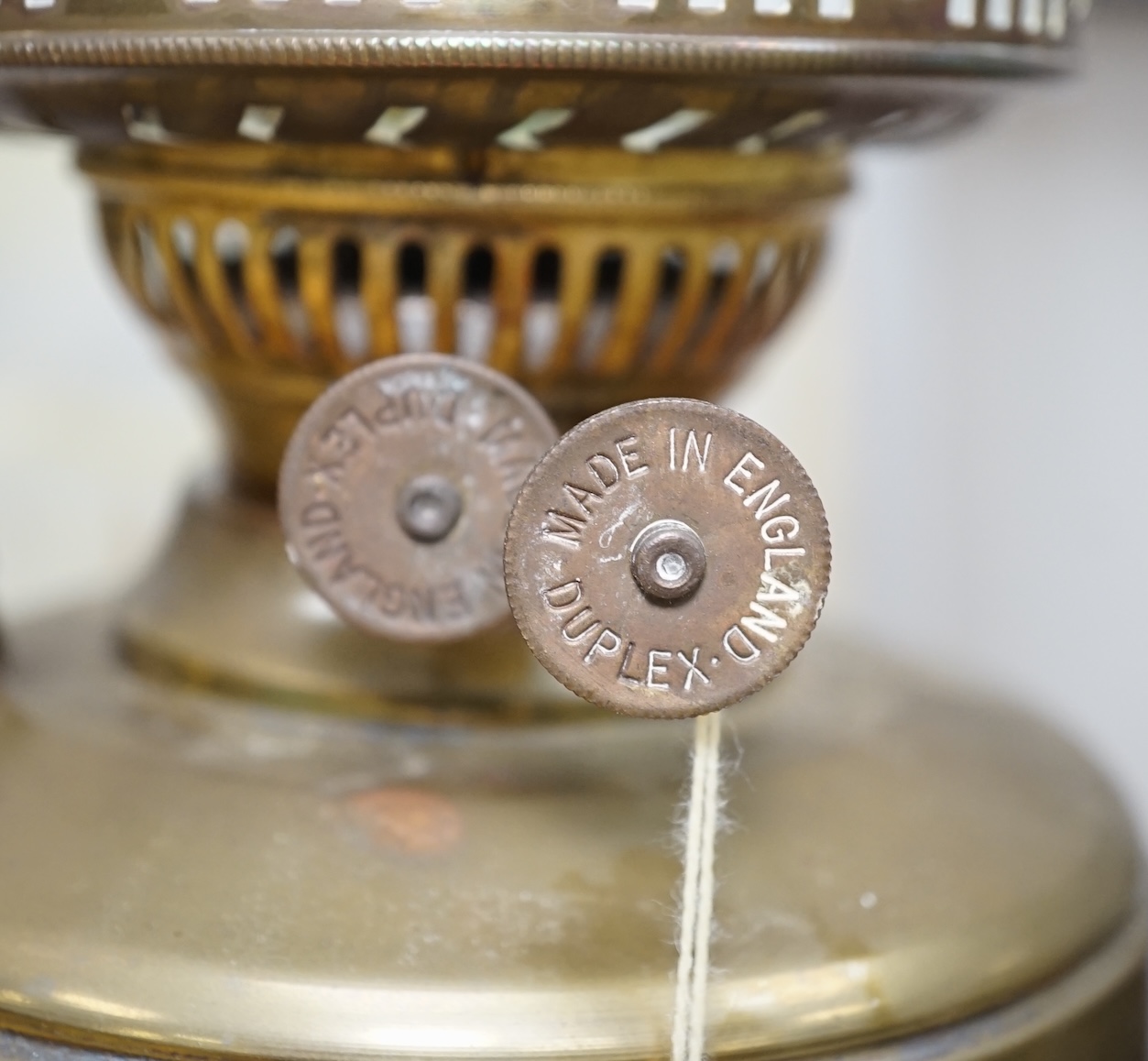 Two Victorian brass oil lamps with white glass shades, 50cm high including funnel. Condition - one tarnished